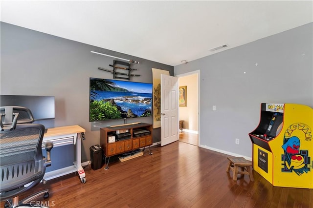 game room with baseboards, visible vents, and wood finished floors