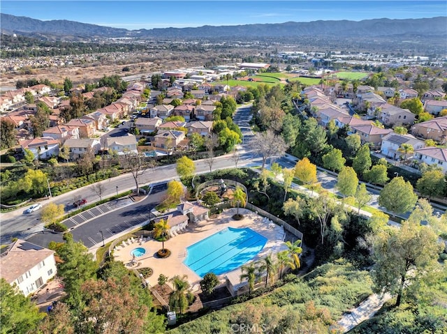 drone / aerial view featuring a residential view and a mountain view