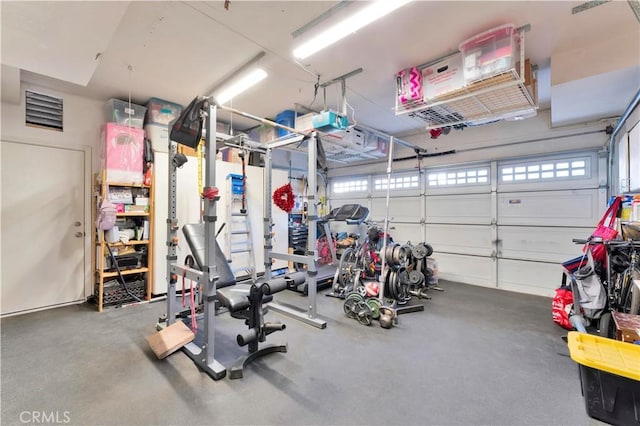 garage with visible vents and a garage door opener