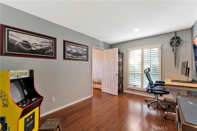 home office with dark wood finished floors and baseboards