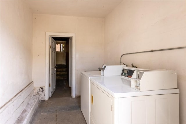 common laundry area with independent washer and dryer