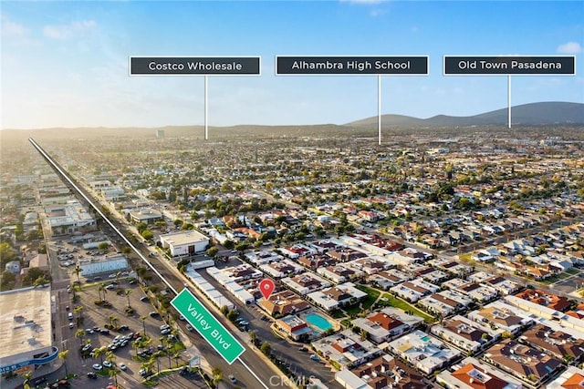 birds eye view of property with a mountain view