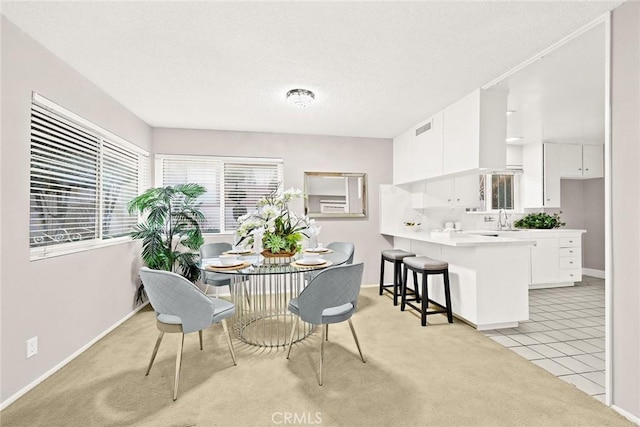 dining space with light tile patterned floors