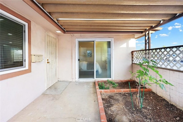 property entrance with a patio