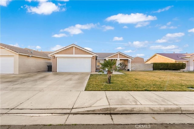 ranch-style home featuring a garage and a front lawn