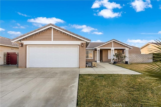 view of front of property featuring a garage and a front yard