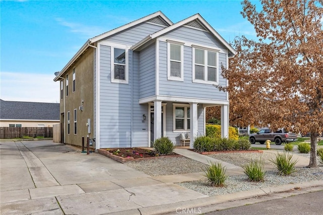 view of front of house with fence