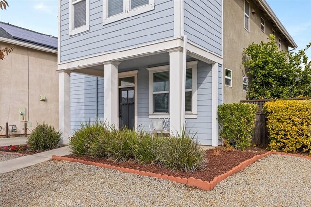 property entrance featuring covered porch