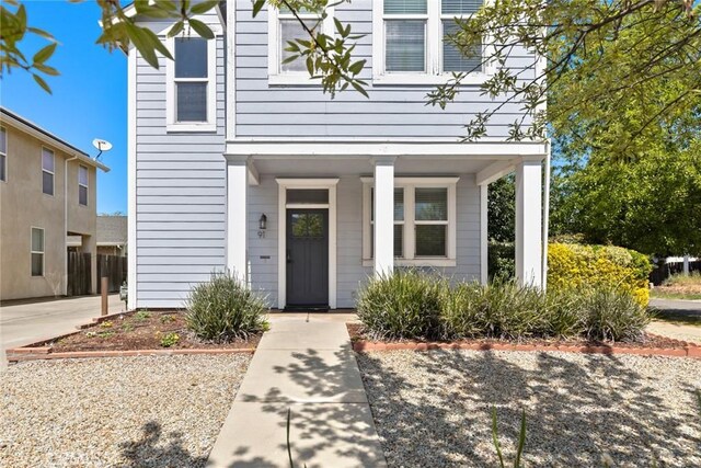 doorway to property featuring covered porch
