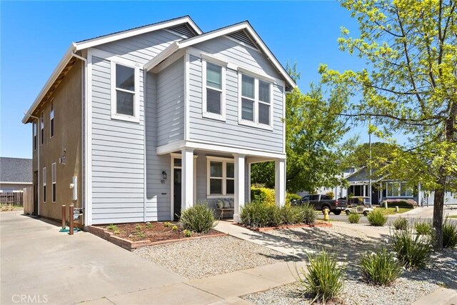 traditional-style home featuring a porch