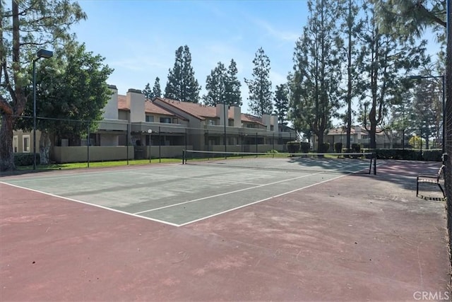 10151 Arrow Rte Unit 123, Rancho Cucamonga, CA 91730 - view of tennis court featuring community basketball court and a residential view