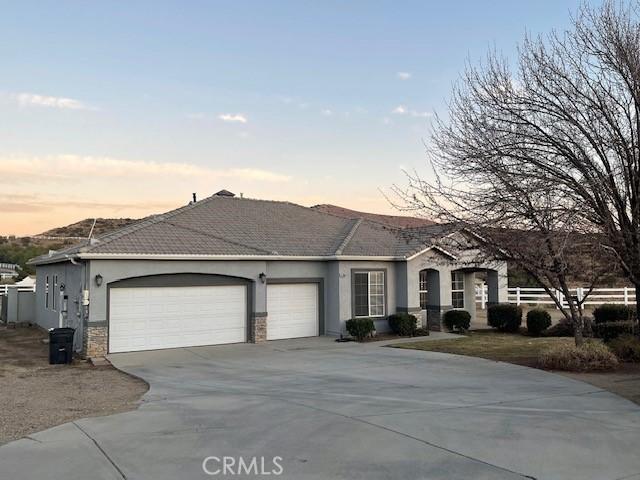 ranch-style home featuring a garage