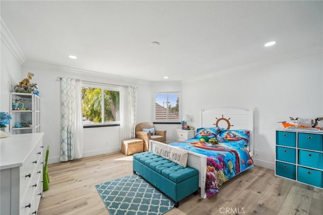 bedroom featuring crown molding and light hardwood / wood-style flooring