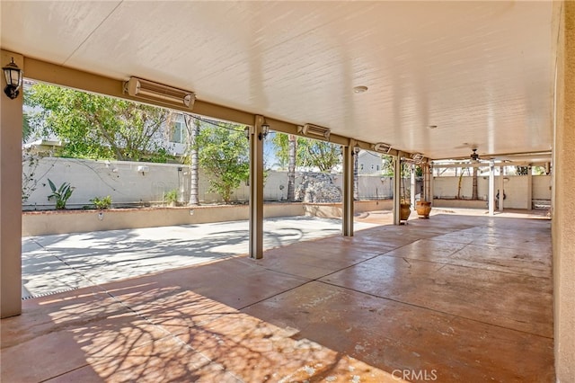 view of patio with a fenced backyard and ceiling fan