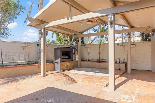 view of patio featuring fence and an outdoor kitchen