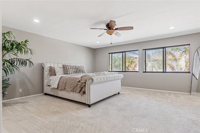 bedroom with light carpet, baseboards, and recessed lighting