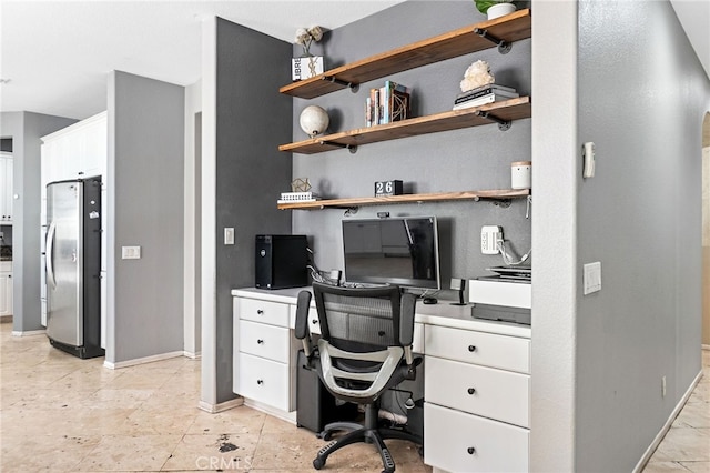 home office with baseboards