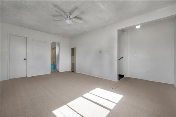 unfurnished bedroom featuring ceiling fan