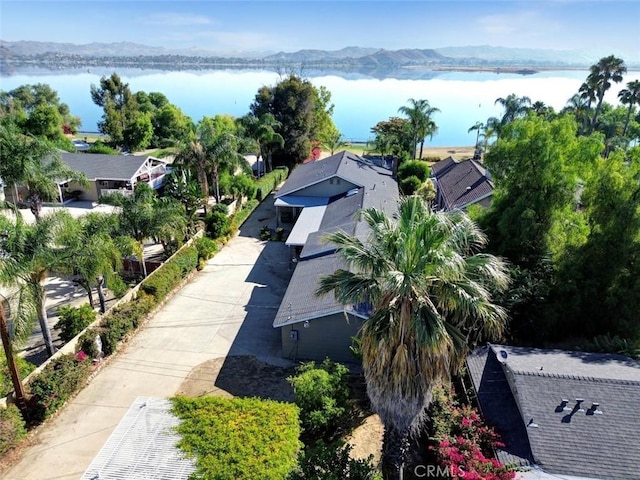 drone / aerial view featuring a water and mountain view