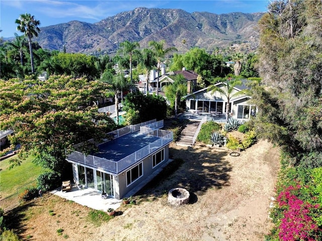 birds eye view of property featuring a mountain view