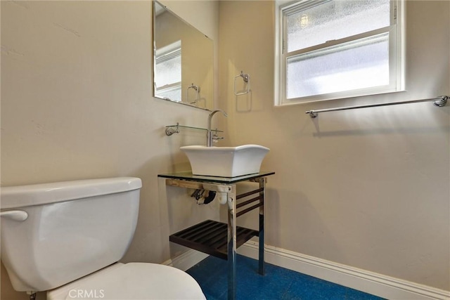 bathroom with sink and toilet