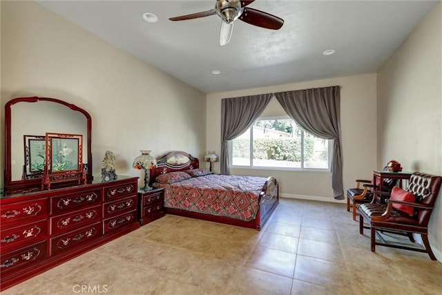 tiled bedroom featuring ceiling fan