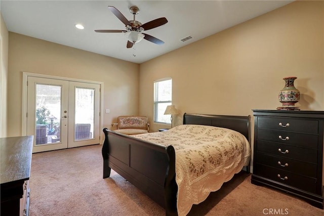 bedroom featuring french doors, access to exterior, light colored carpet, and ceiling fan