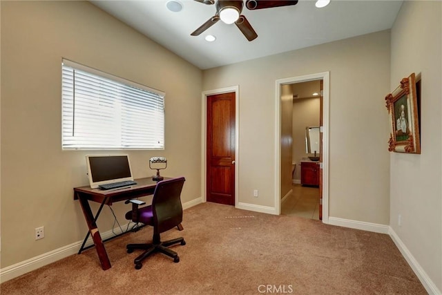 carpeted home office with ceiling fan