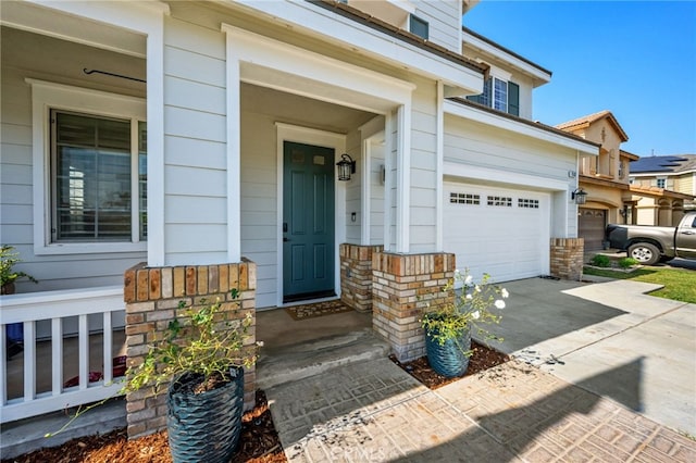 view of exterior entry featuring a garage