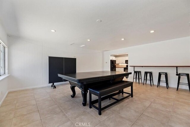 dining area with light tile patterned floors, baseboards, and recessed lighting