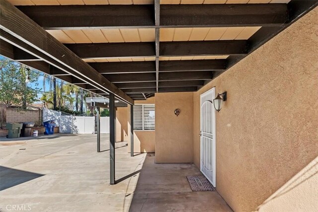 view of patio / terrace featuring fence