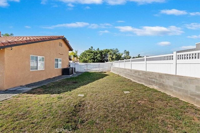 view of yard featuring cooling unit and a fenced backyard