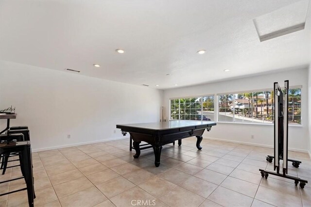 recreation room with light tile patterned floors, visible vents, baseboards, and recessed lighting