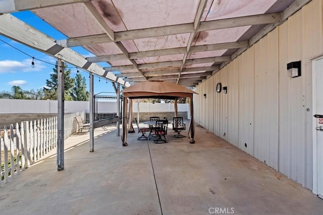 view of patio featuring a gazebo and fence