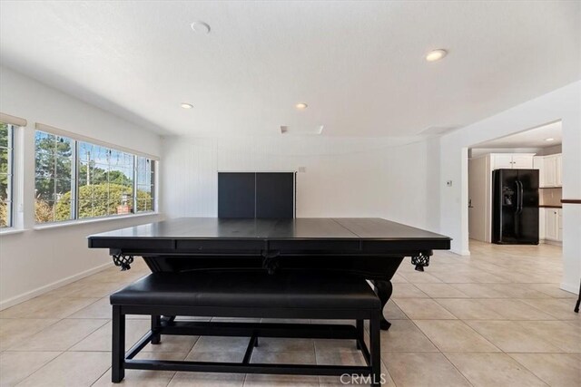 dining space featuring light tile patterned floors, baseboards, and recessed lighting