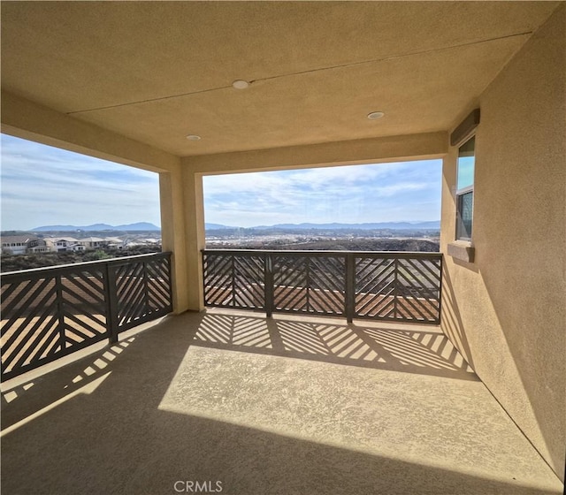 balcony featuring a mountain view