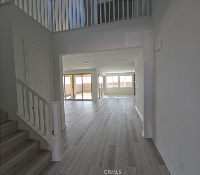 hallway featuring light wood-type flooring