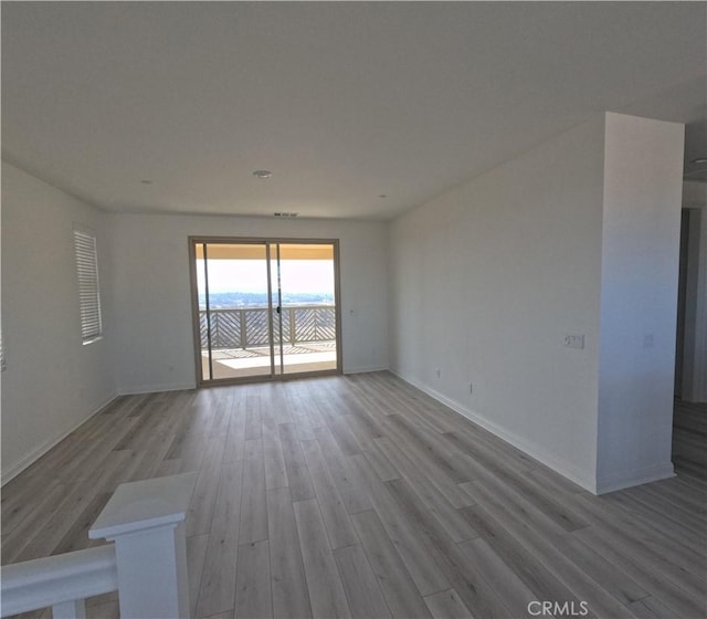 spare room featuring hardwood / wood-style floors