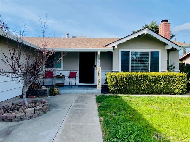 view of front of house with a front lawn and a porch