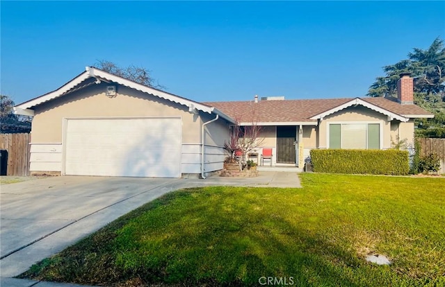 ranch-style house featuring a front yard and a garage