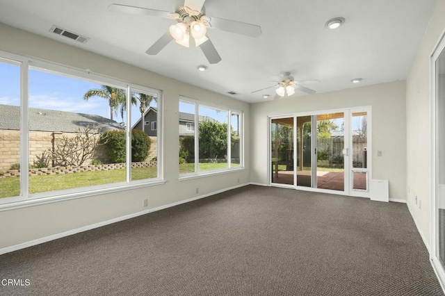 unfurnished sunroom featuring visible vents