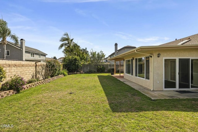 view of yard with a patio and a fenced backyard