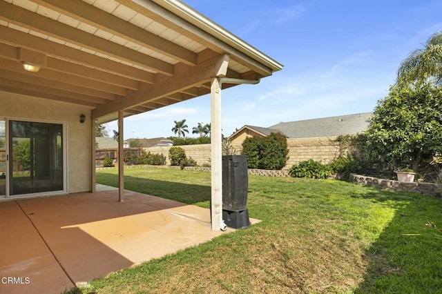 view of yard featuring a patio and fence