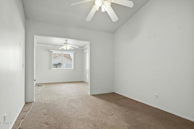 carpeted spare room featuring baseboards