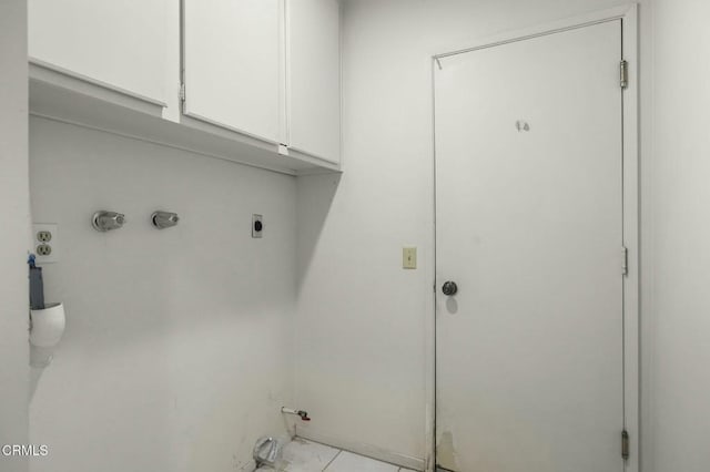 washroom featuring cabinet space, hookup for an electric dryer, and washer hookup