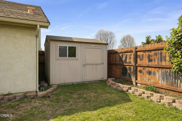 view of shed featuring a fenced backyard