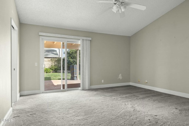 carpeted empty room with ceiling fan, a textured ceiling, and baseboards