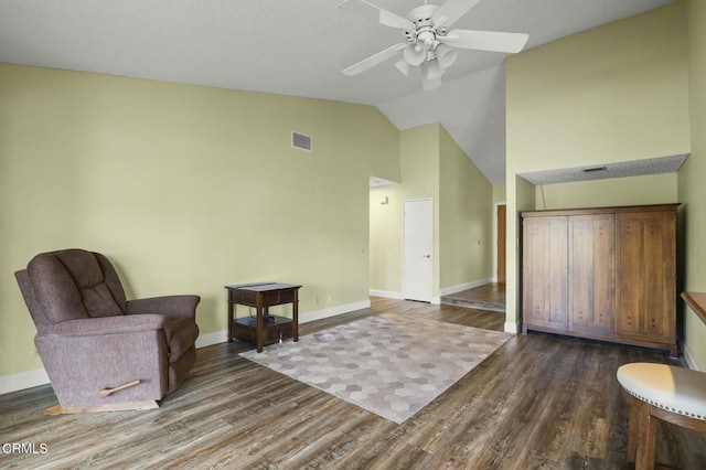 sitting room featuring visible vents, ceiling fan, baseboards, wood finished floors, and high vaulted ceiling