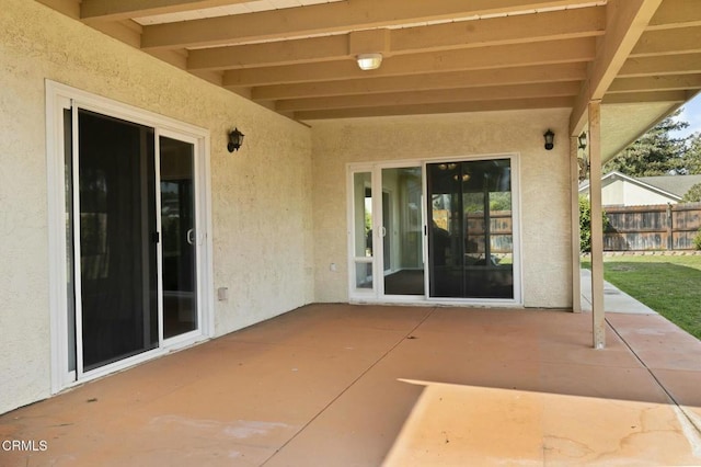 view of patio / terrace featuring fence