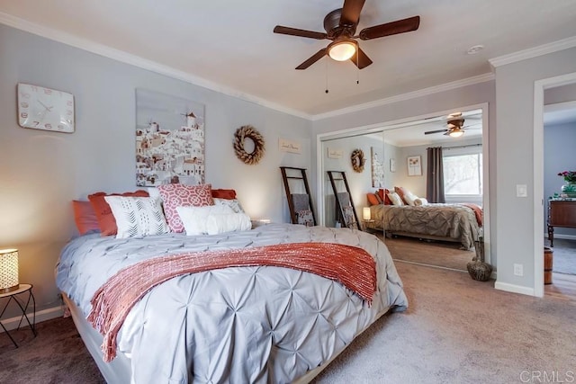 carpeted bedroom with a closet, crown molding, and ceiling fan